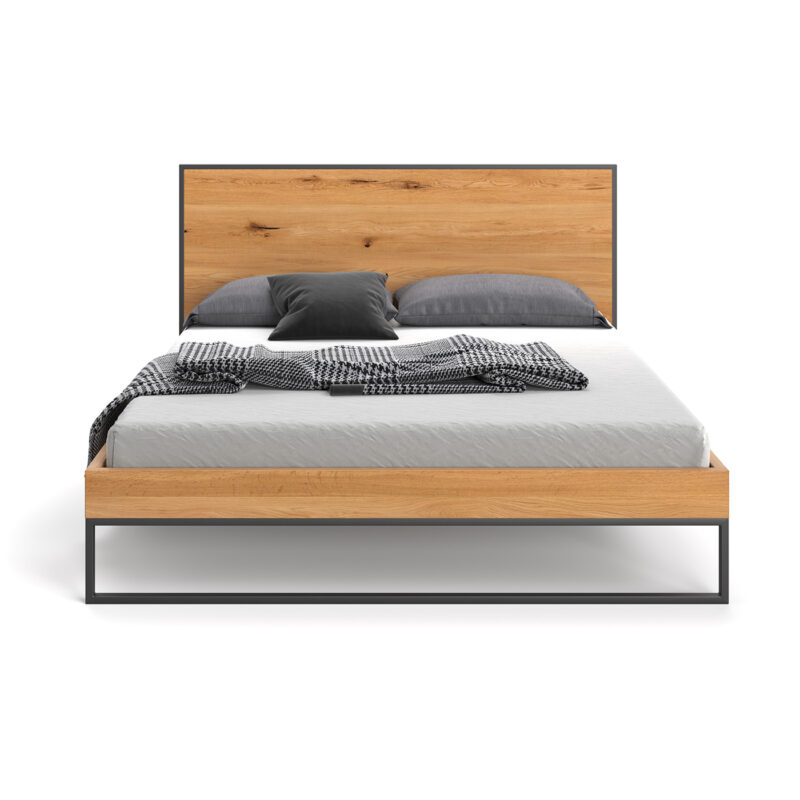 Łóżko Frame wykonane z litego drewna dębowego i metalu.