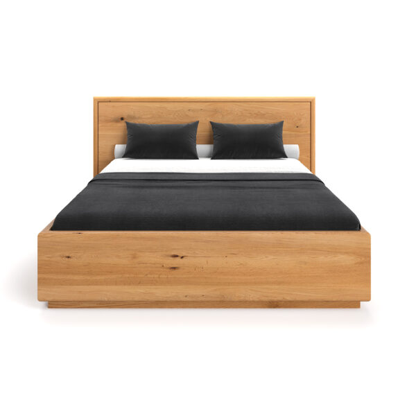 Łóżko Valor z pojemnikiem wykonane z litego drewna dębowego.